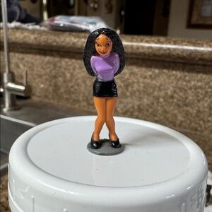 The Mija figure is part of the Homies Series 5 set.